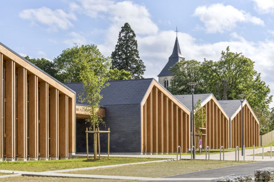 Repurposed slate covers this entire timber school in France